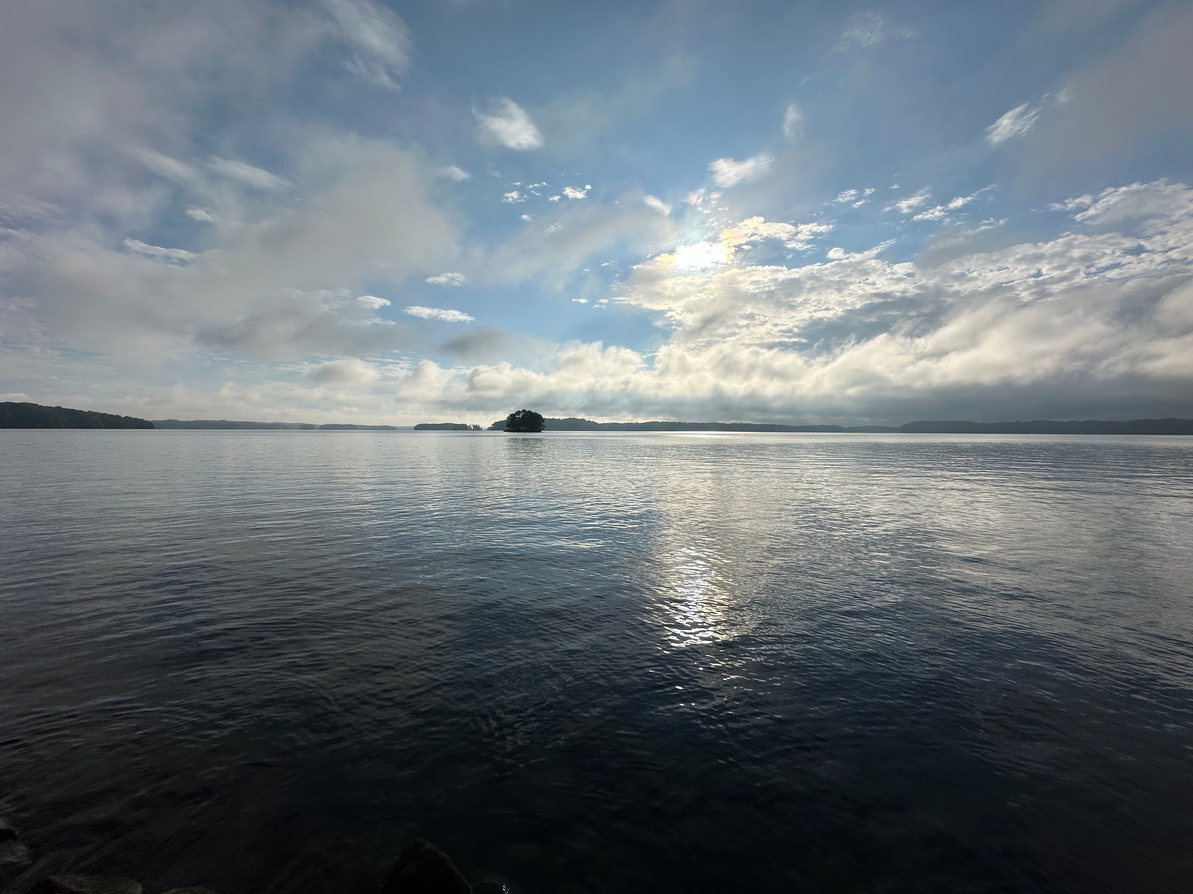 A boat on open water at dusk